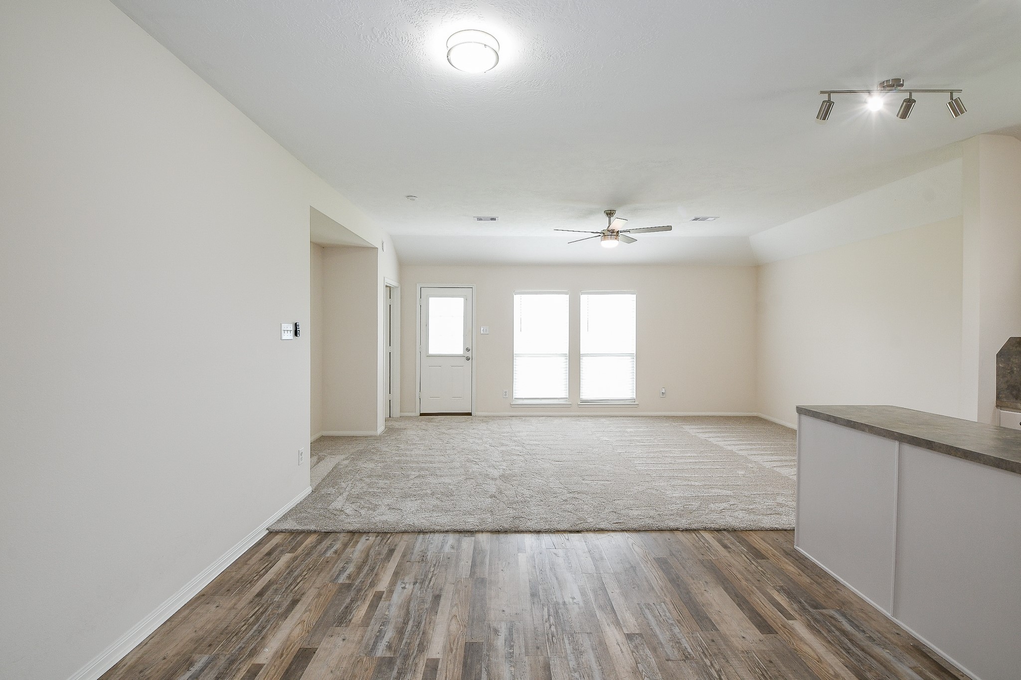 9203 Windy Spring Court Houston, TX 77089 - Photo 7 of 33 wooden floor in an empty room with a window