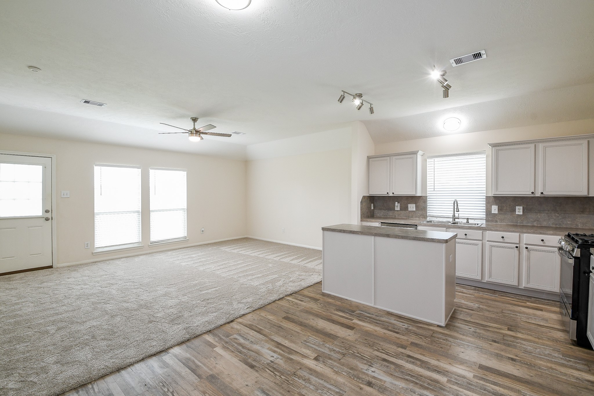 9203 Windy Spring Court Houston, TX 77089 - Photo 8 of 33 a kitchen with a sink cabinets and wooden floor