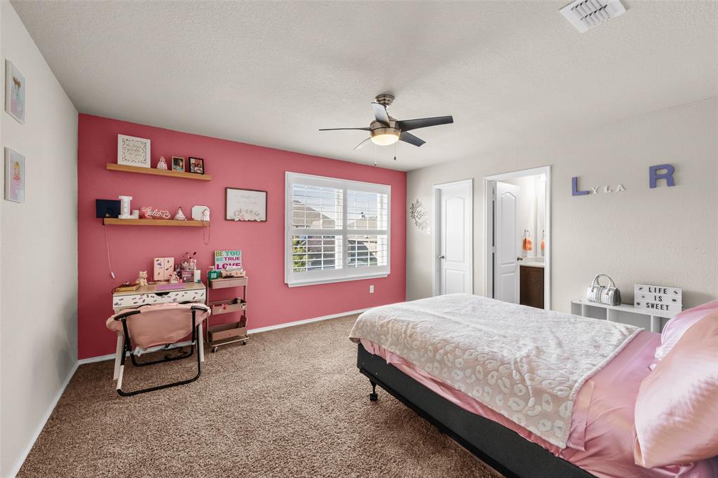 3709 Juniperio Street Denton, TX 76208 - Photo 23 of 31 a bedroom with a bed chair and a window