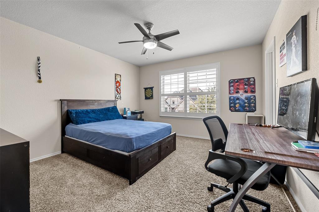 3709 Juniperio Street Denton, TX 76208 - Photo 25 of 31 a bedroom with a bed and a desk