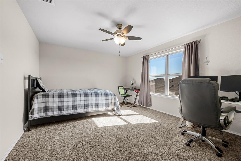 3709 Juniperio Street Denton, TX 76208 - Photo 27 of 31 a workspace with chandelier and a window