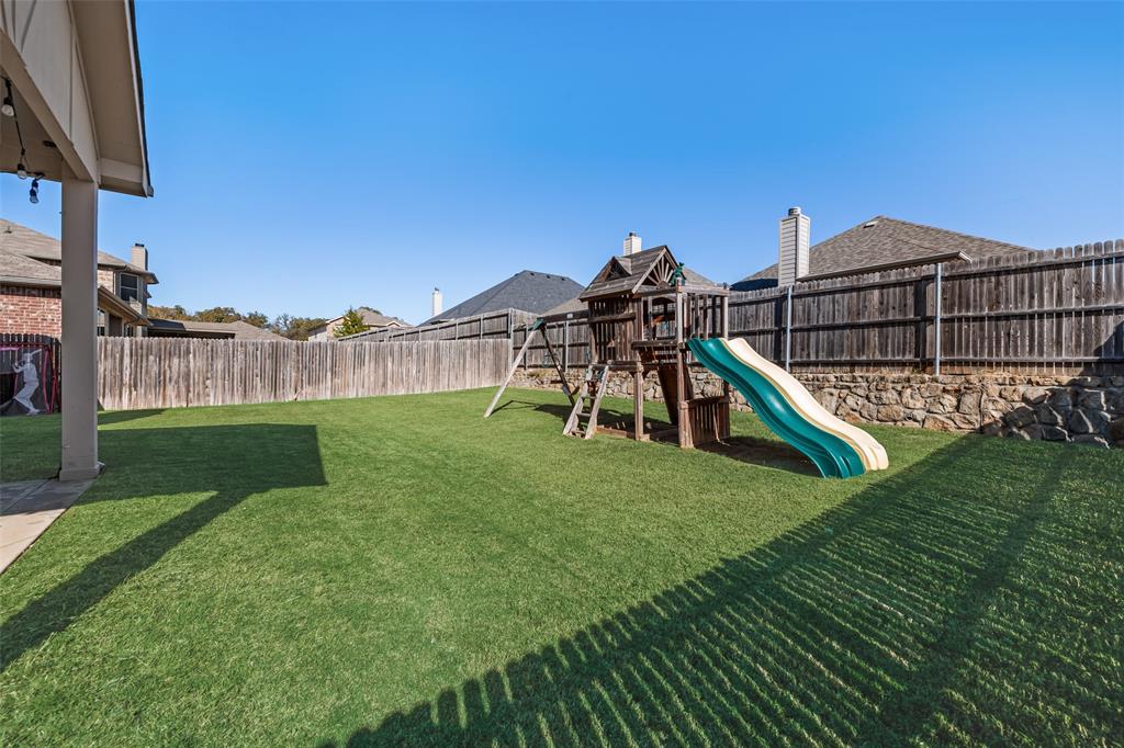3709 Juniperio Street Denton, TX 76208 - Photo 29 of 31 a view of a house with a yard