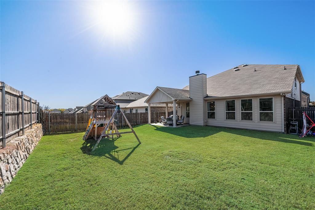 3709 Juniperio Street Denton, TX 76208 - Photo 30 of 31 a view of a house with backyard