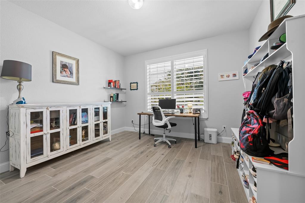 3709 Juniperio Street Denton, TX 76208 - Photo 6 of 31 a view of a workspace with furniture and a window