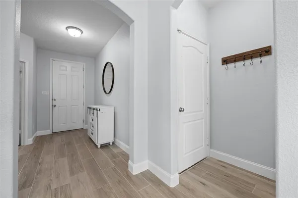 a bathroom with a granite countertop sink a mirror and shower