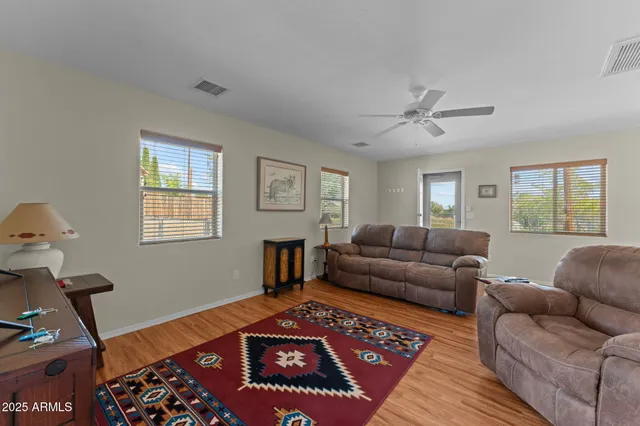 a living room with furniture and a window