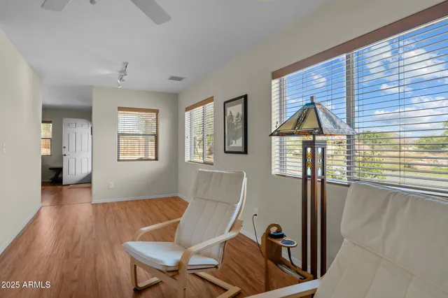 a view of a livingroom with furniture and windows