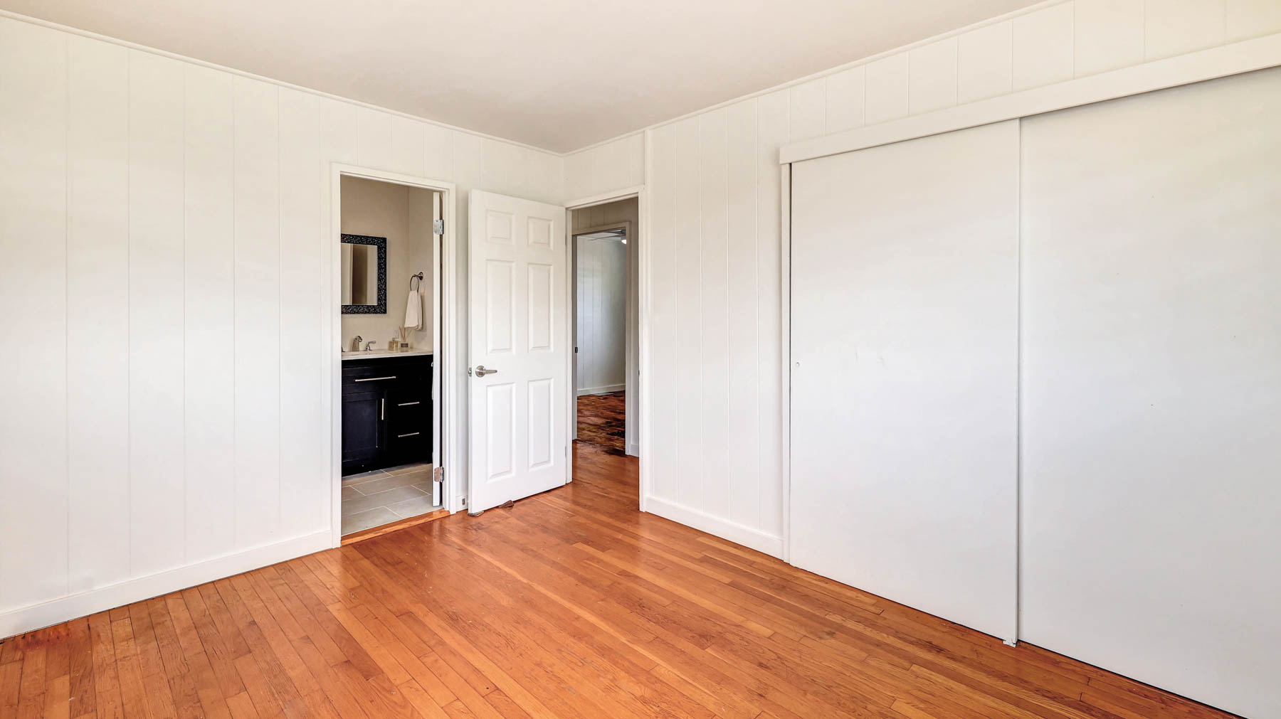 7954 B Kekaha Road Kekaha, HI 96752 - Photo 12 of 24 a view of an empty room with wooden floor