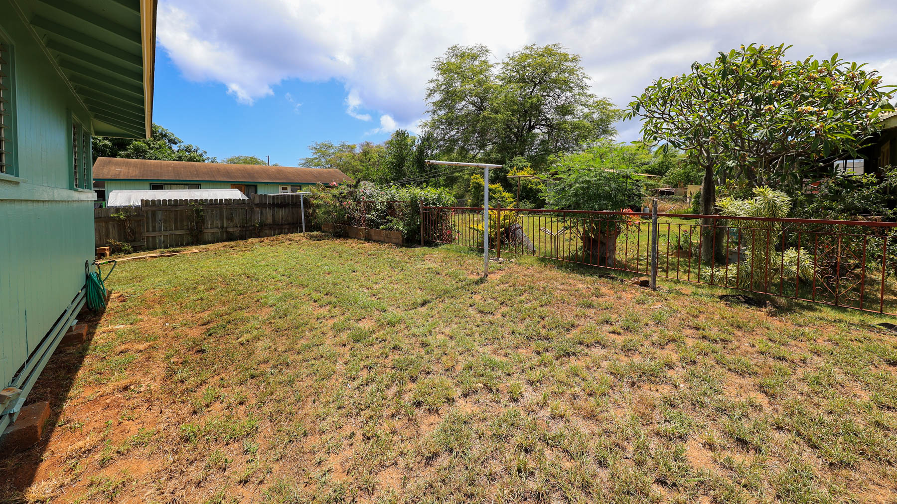 7954 B Kekaha Road Kekaha, HI 96752 - Photo 17 of 24 a view of backyard with large trees and plants