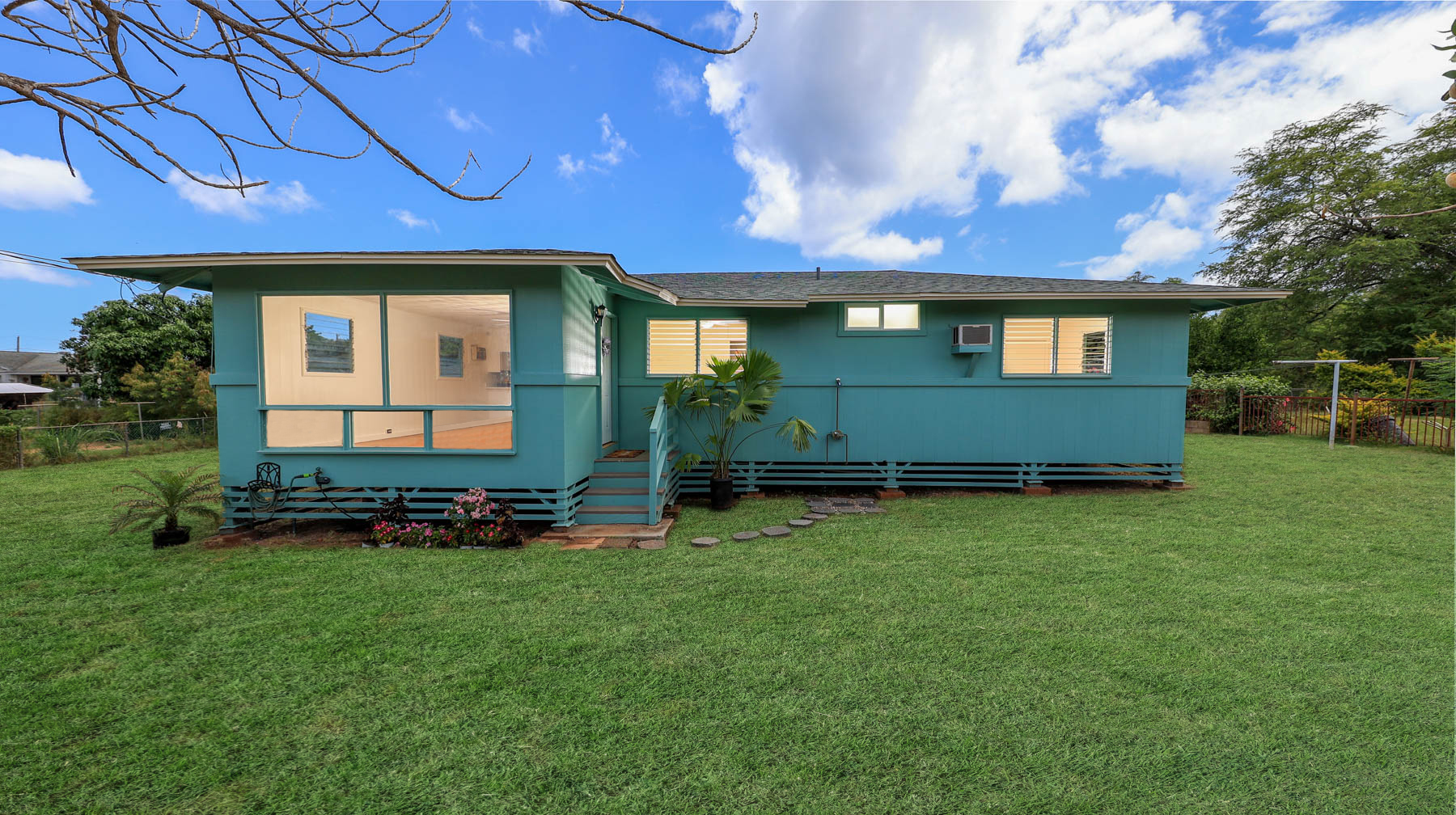 7954 B Kekaha Road Kekaha, HI 96752 - Photo 19 of 24 a front view of a house with a garden