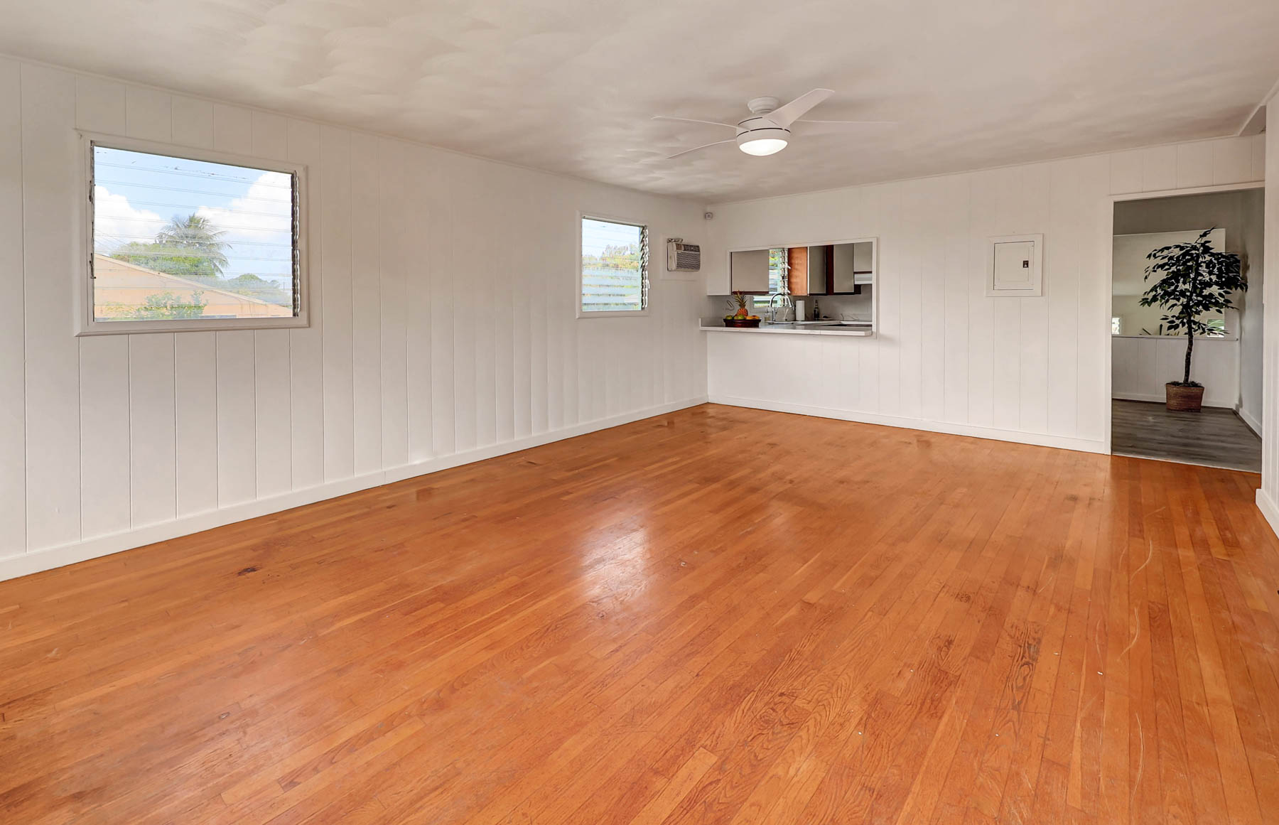 7954 B Kekaha Road Kekaha, HI 96752 - Photo 4 of 24 a view of a room with wooden floor and windows