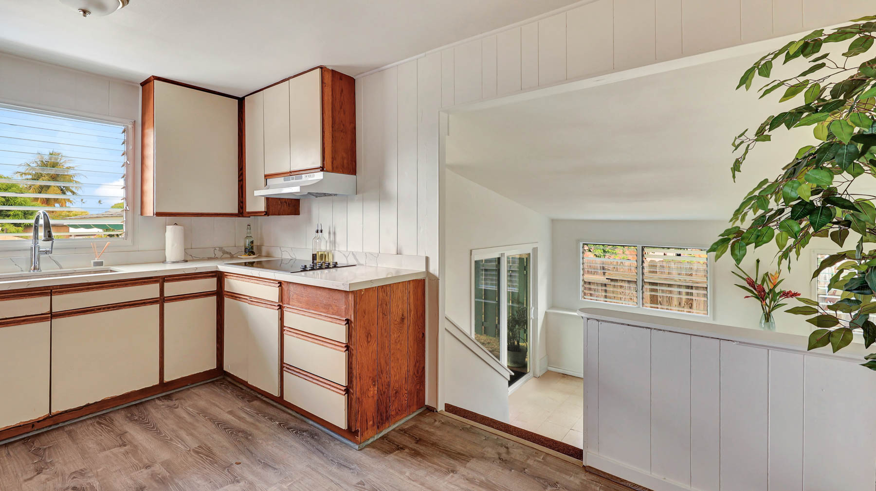 7954 B Kekaha Road Kekaha, HI 96752 - Photo 9 of 24 a kitchen with stainless steel appliances granite countertop a sink and a stove next to a window