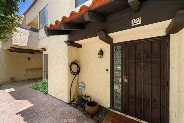 a view of a front door and wooden door