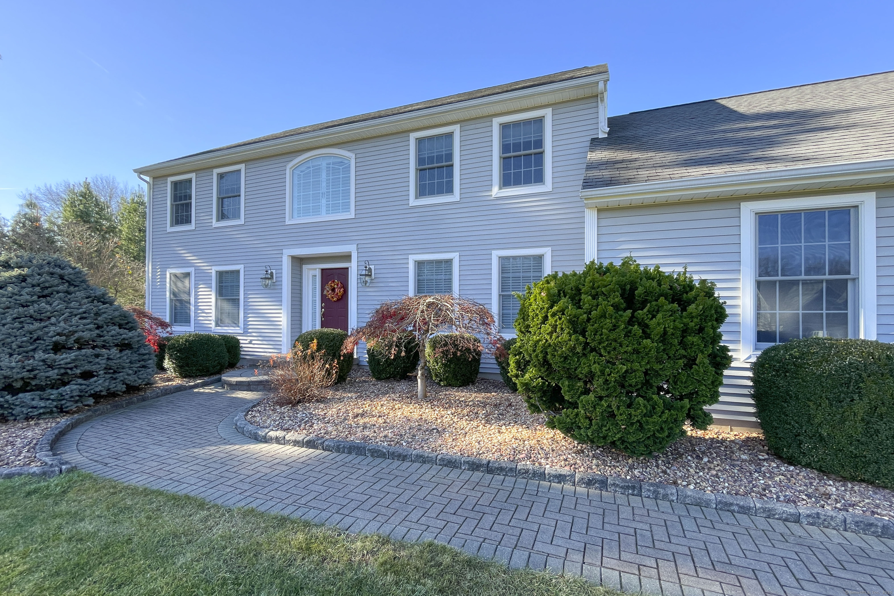 a front view of a house with garden