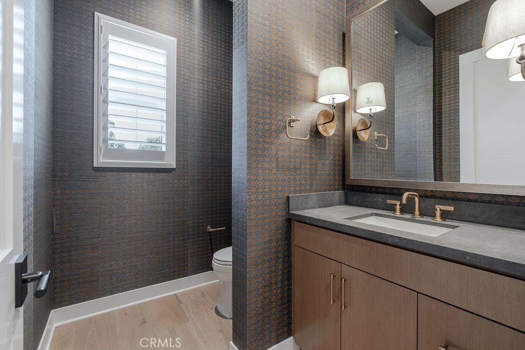 737 Via Arezzo Place Altadena, CA 91001 - Photo 16 of 25 a bathroom with a granite countertop sink toilet and mirror