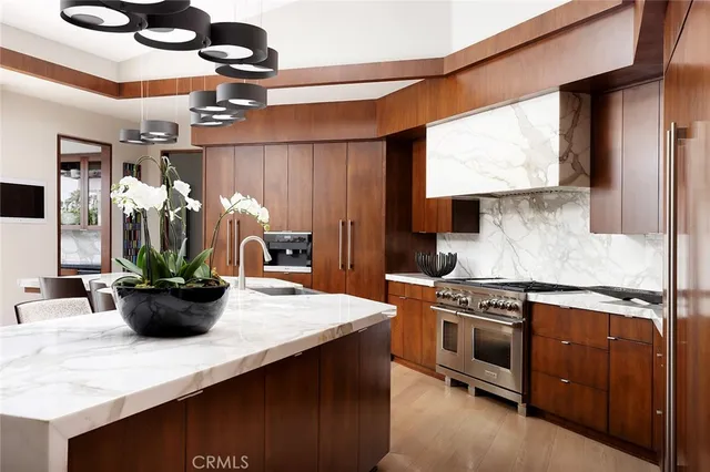 a kitchen with a stove and a white cabinet