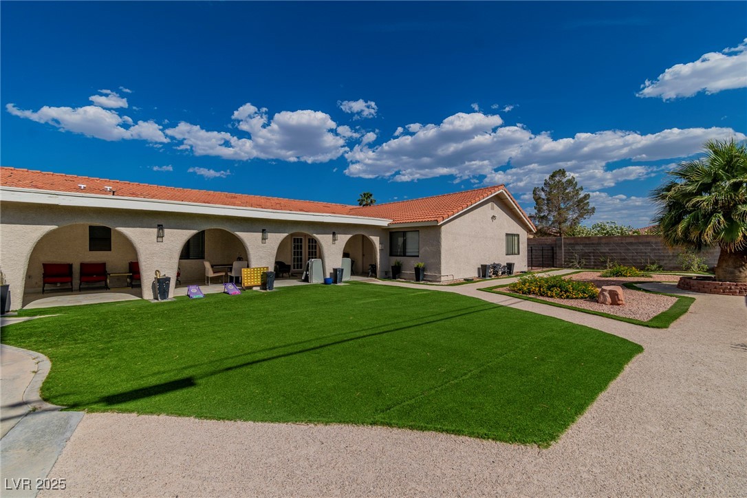 465 East Robindale Road Las Vegas, NV 89123 - Photo 13 of 32 Back of property with a patio, stucco siding, a ti