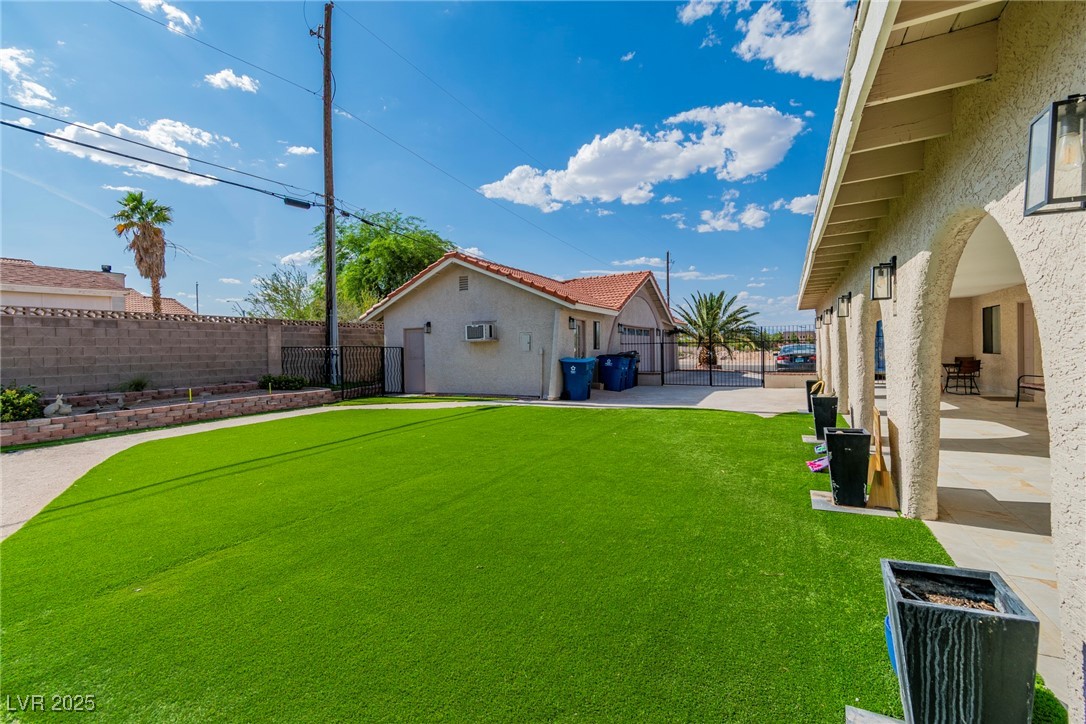 465 East Robindale Road Las Vegas, NV 89123 - Photo 22 of 32 Fenced backyard with a patio