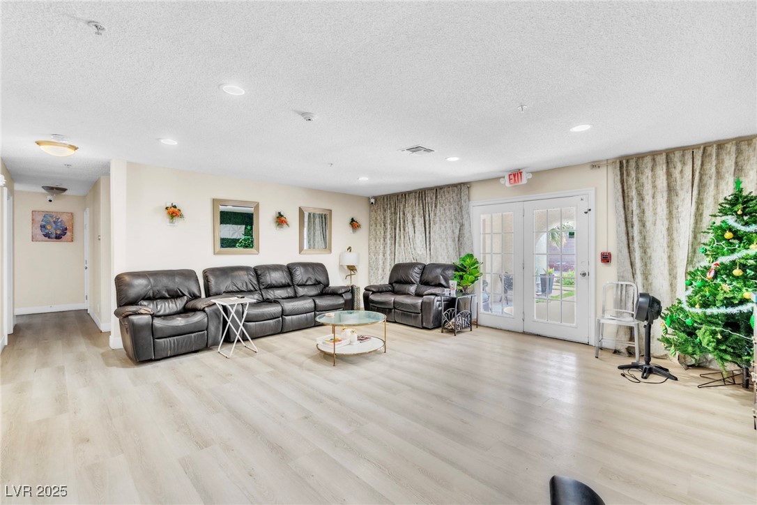 465 East Robindale Road Las Vegas, NV 89123 - Photo 25 of 32 Living room featuring a textured ceiling, recessed