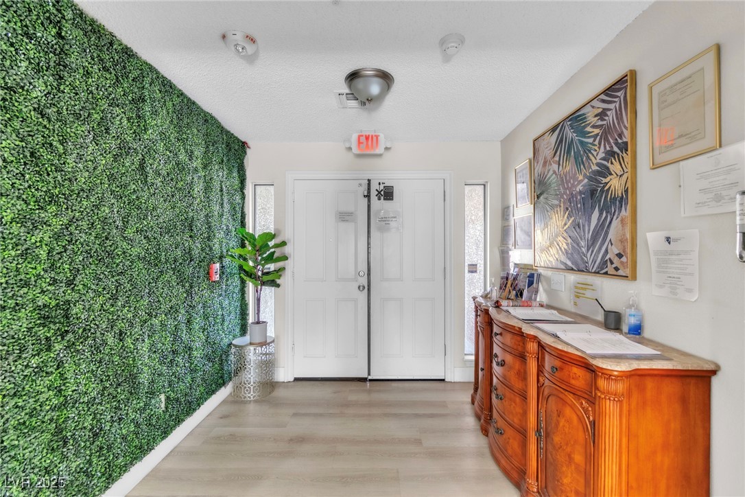 465 East Robindale Road Las Vegas, NV 89123 - Photo 28 of 32 Foyer with light wood-style flooring and a texture