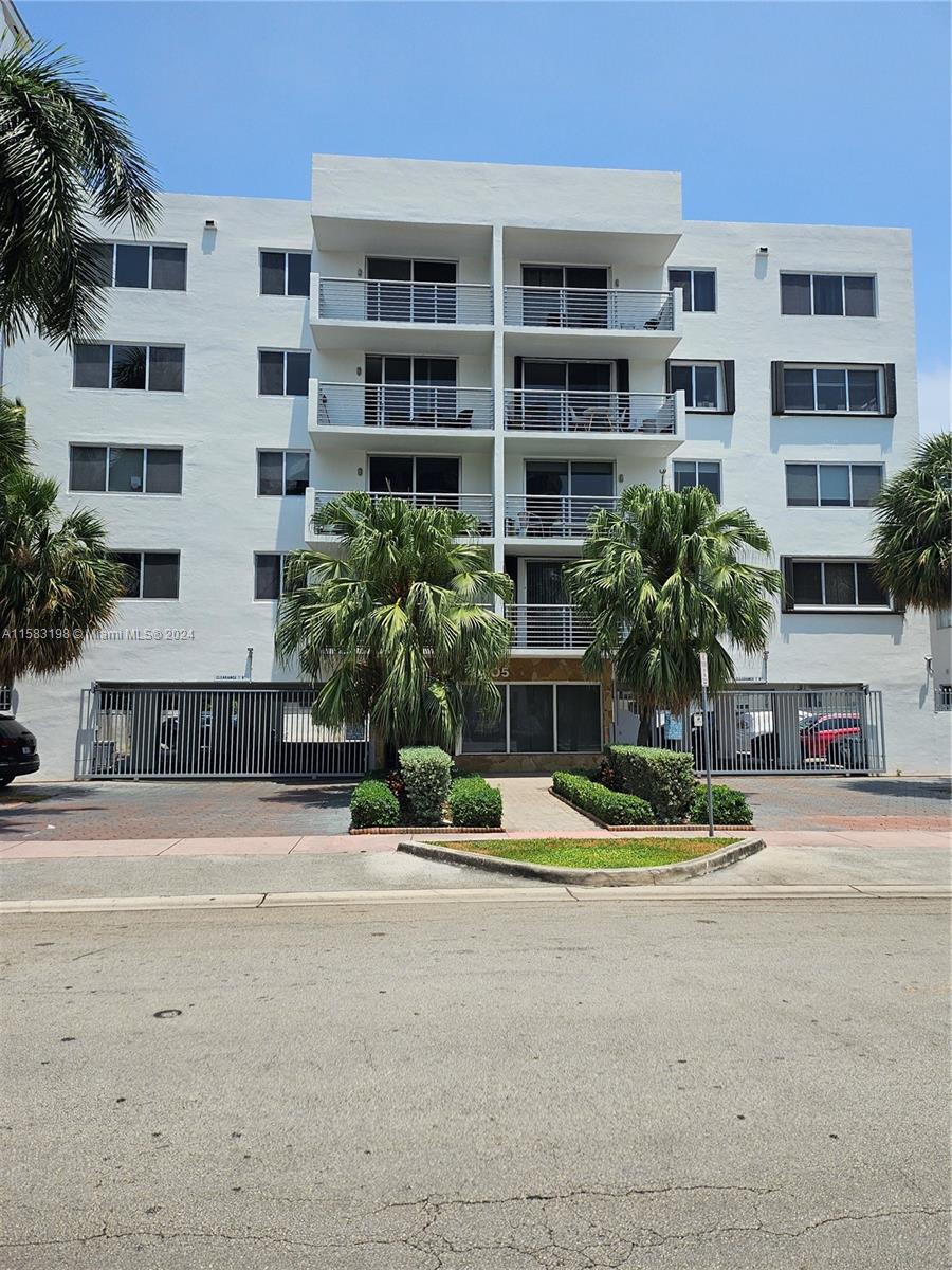 1605 Bay Road, Unit 406 Miami Beach, FL 33139 - Photo 1 of 31 a view of pool with outdoor seating and house