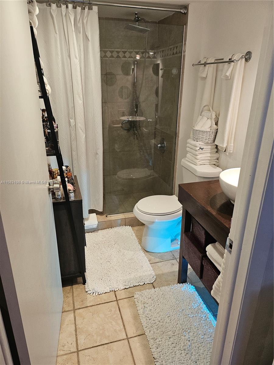 1605 Bay Road, Unit 406 Miami Beach, FL 33139 - Photo 20 of 31 a bathroom with a sink and toilet