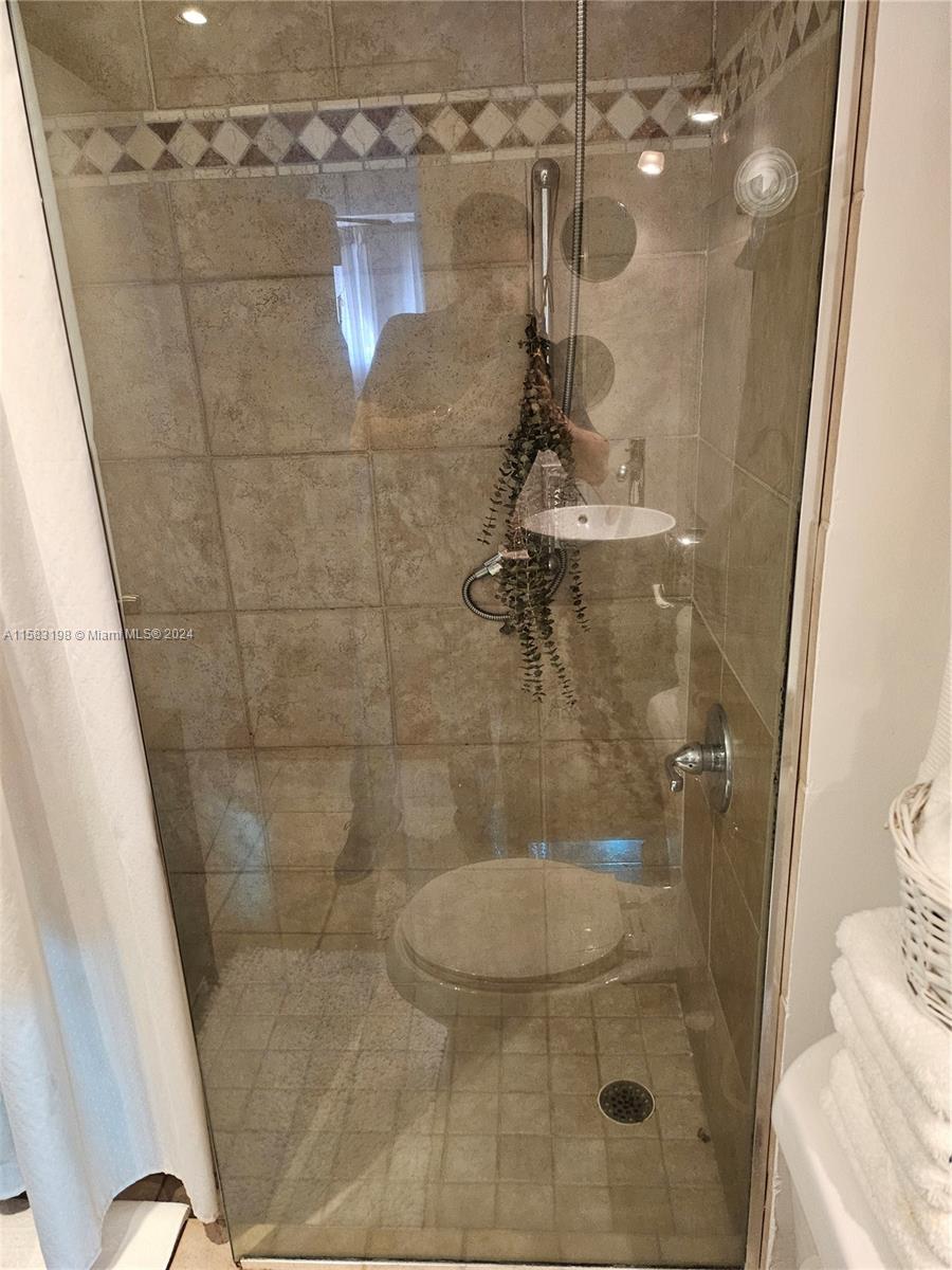 1605 Bay Road, Unit 406 Miami Beach, FL 33139 - Photo 22 of 31 a bathroom with a shower