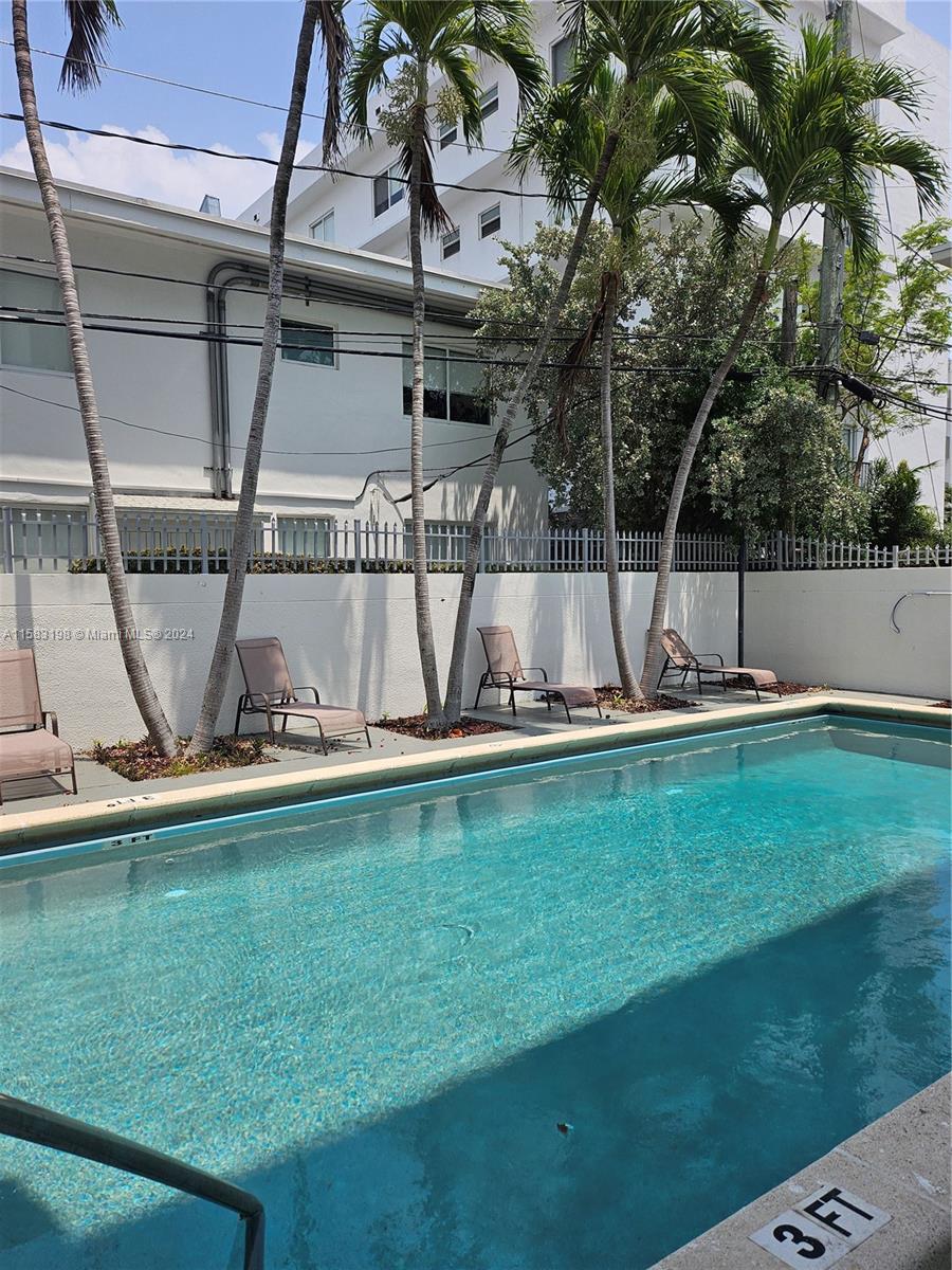 1605 Bay Road, Unit 406 Miami Beach, FL 33139 - Photo 31 of 31 a view of a swimming pool with a yard