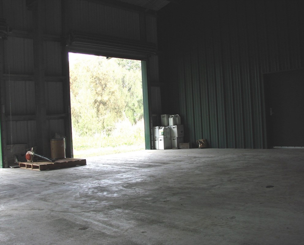 47-4630 Cane Haul Road Honokaa, HI 96727 - Photo 5 of 9 a view of an empty room with a fireplace