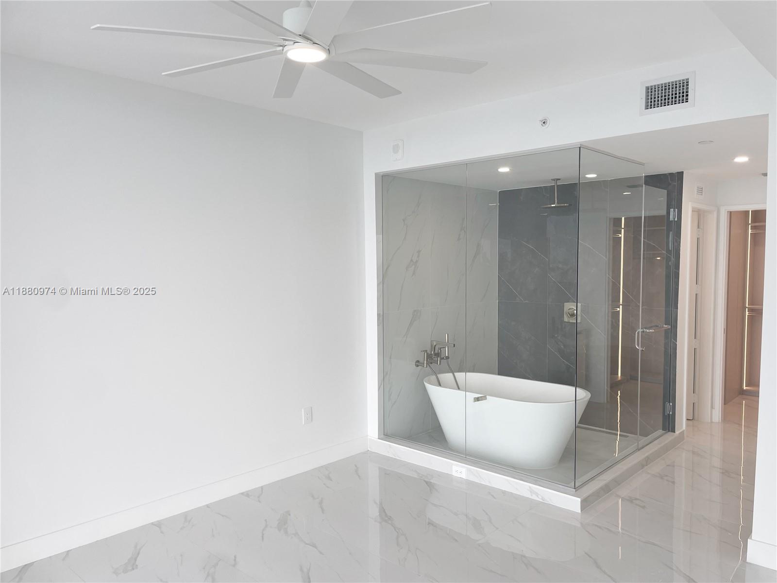 700 Northeast 24th Street, Unit 4604 Miami, FL 33137 - Photo 9 of 41 a bathroom with a bathtub and shower