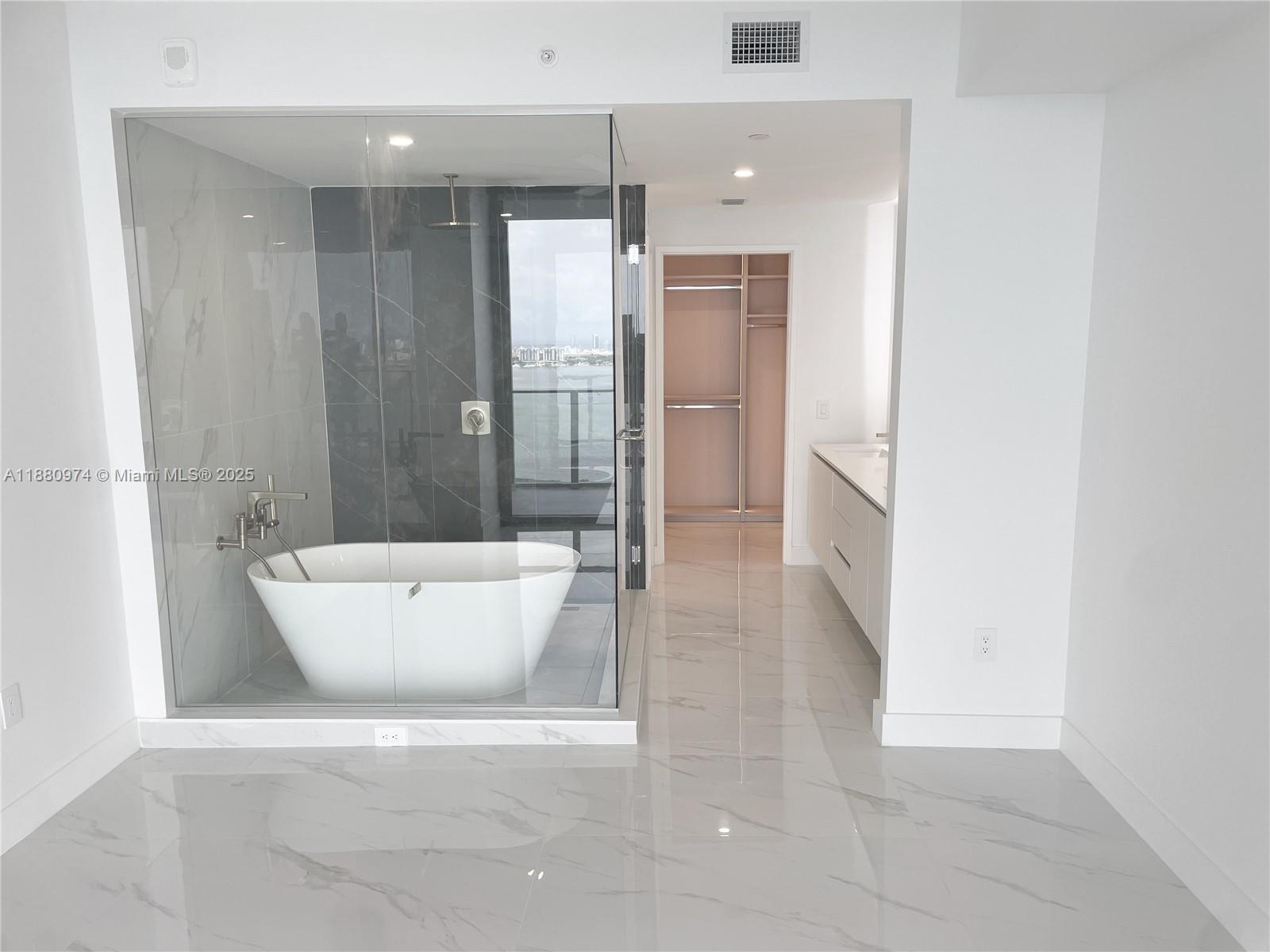 700 Northeast 24th Street, Unit 4604 Miami, FL 33137 - Photo 10 of 41 a bathroom with a bathtub and shower