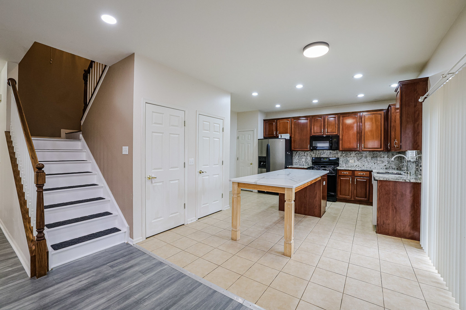 204 Aspen Circle Gilberts, IL 60136 - Photo 10 of 25 a open kitchen with stainless steel appliances granite countertop a refrigerator and a stove top oven