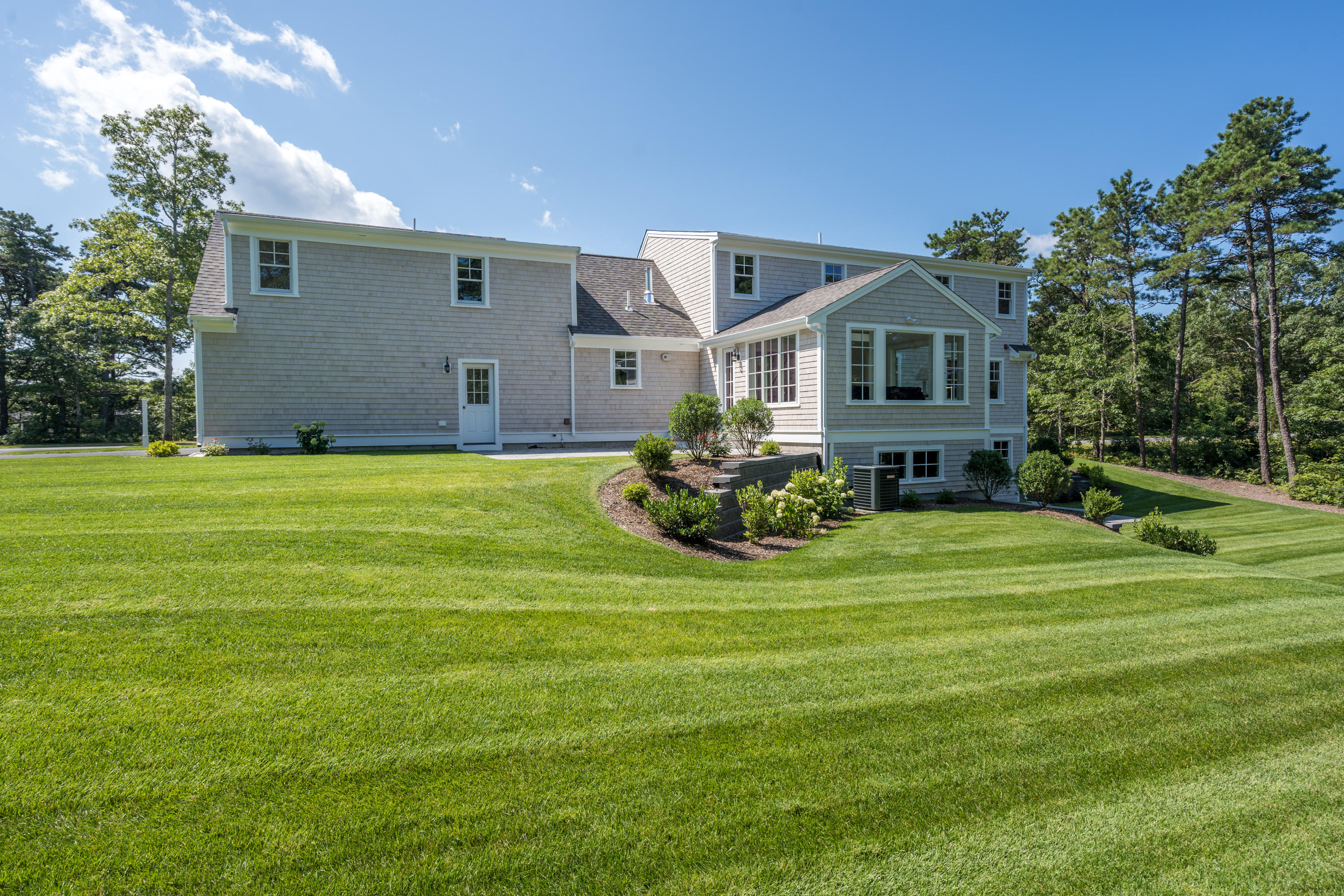 14 Crocker Rise Road Harwich, MA 02645 - Photo 29 of 38 a front view of a house with a garden