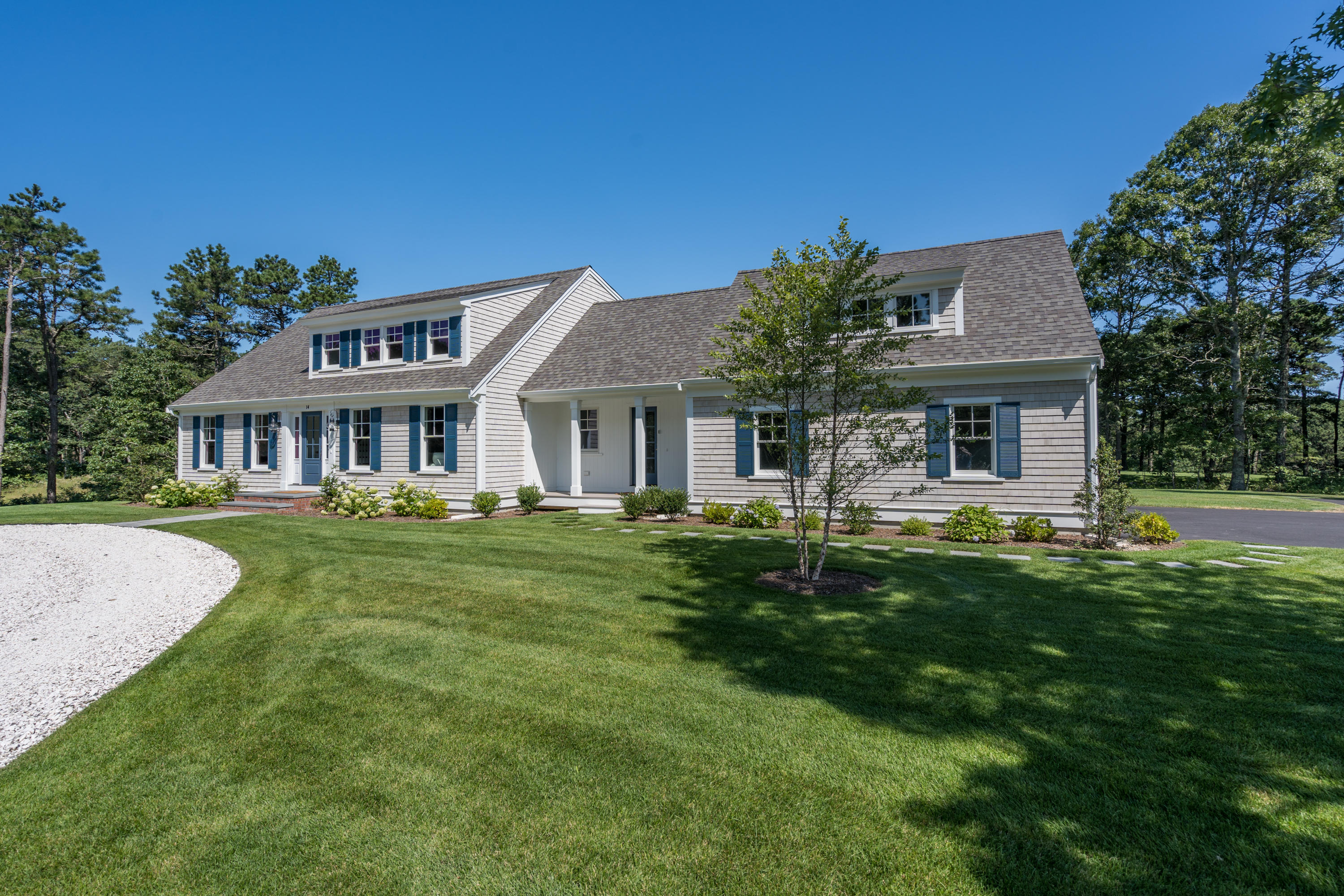14 Crocker Rise Road Harwich, MA 02645 - Photo 31 of 38 a front view of a house with a garden