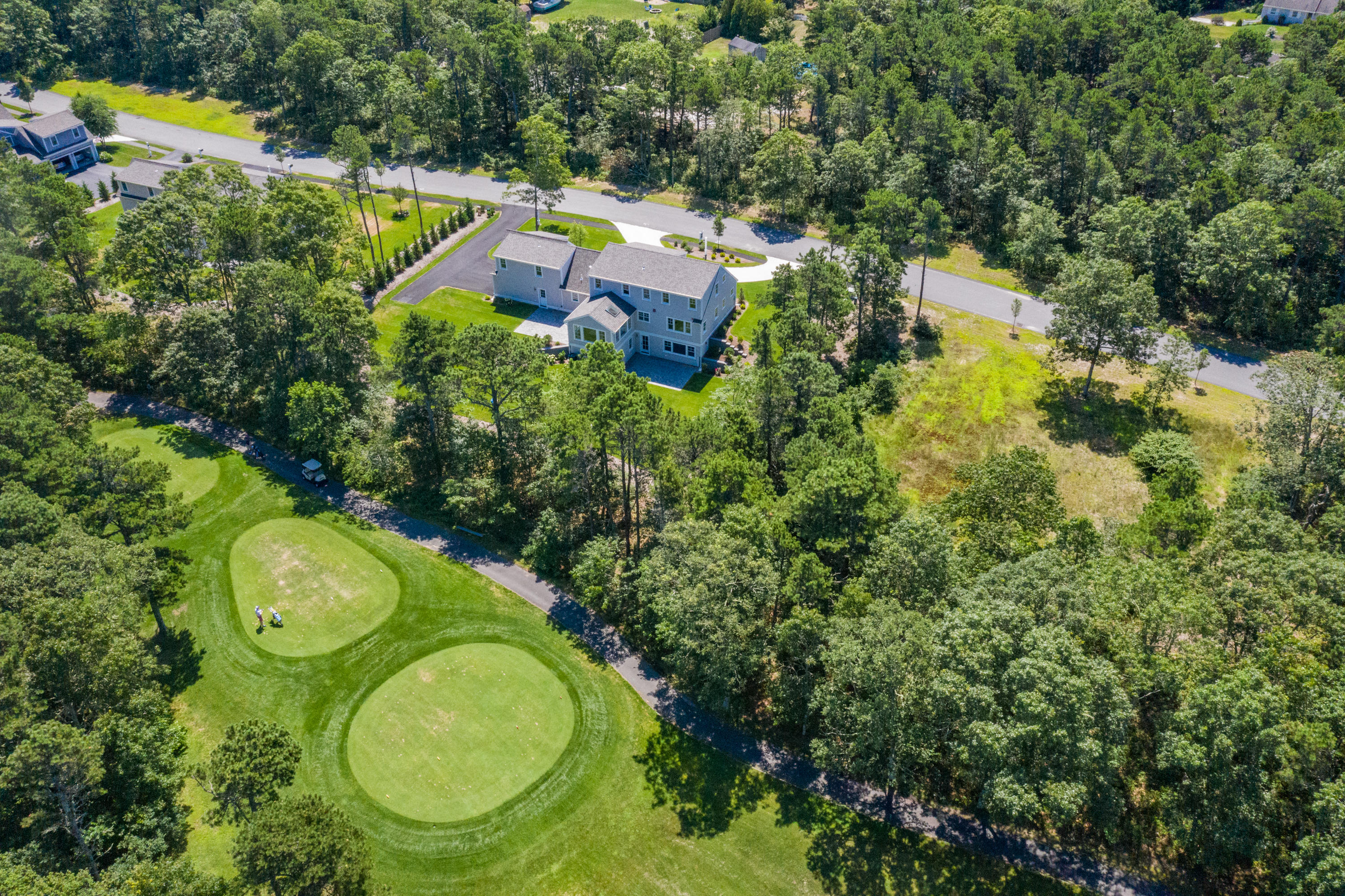 14 Crocker Rise Road Harwich, MA 02645 - Photo 32 of 38 an aerial view of a house with a swimming pool outdoor seating and yard