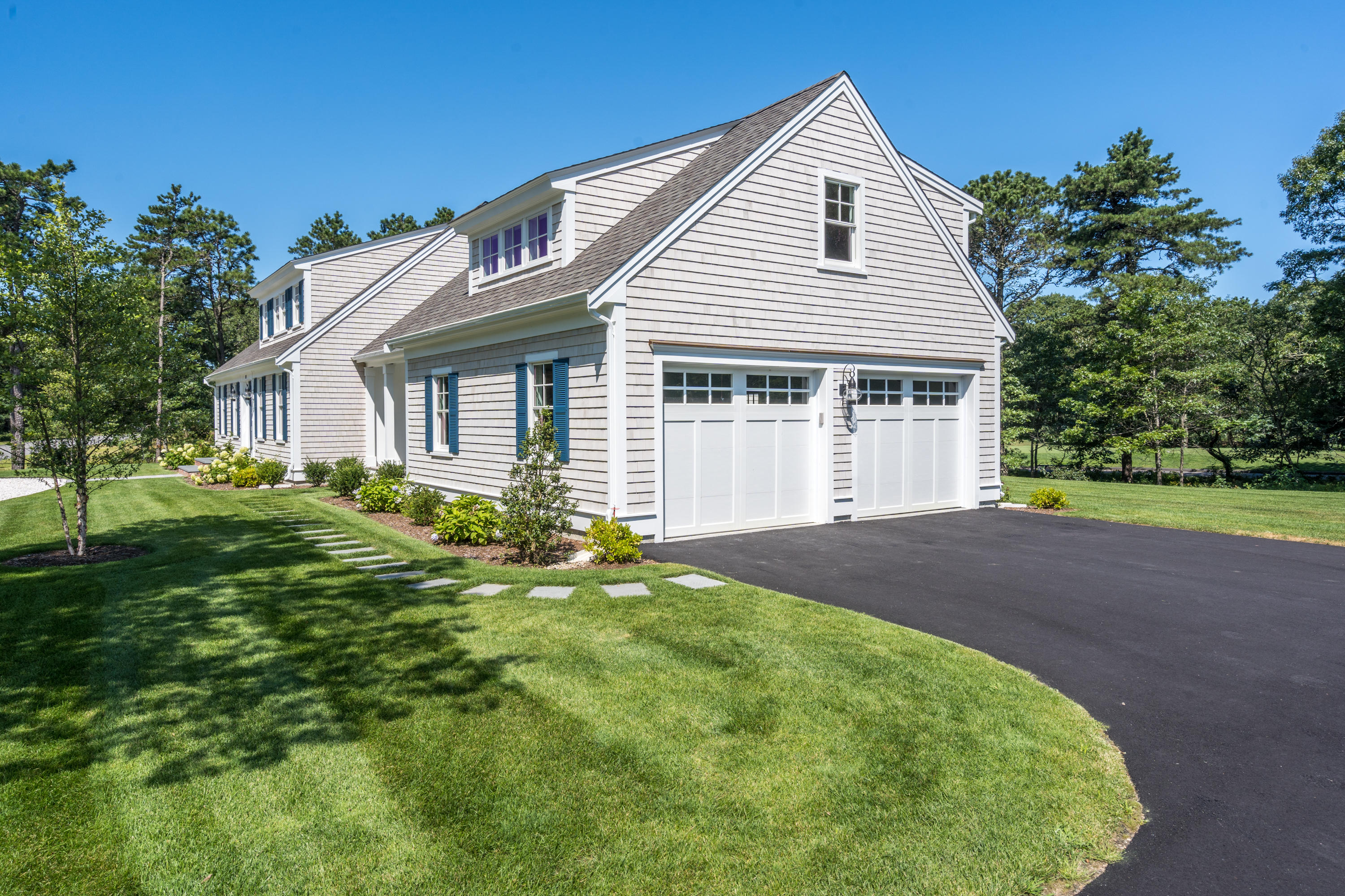 14 Crocker Rise Road Harwich, MA 02645 - Photo 33 of 38 a front view of a house with a garden