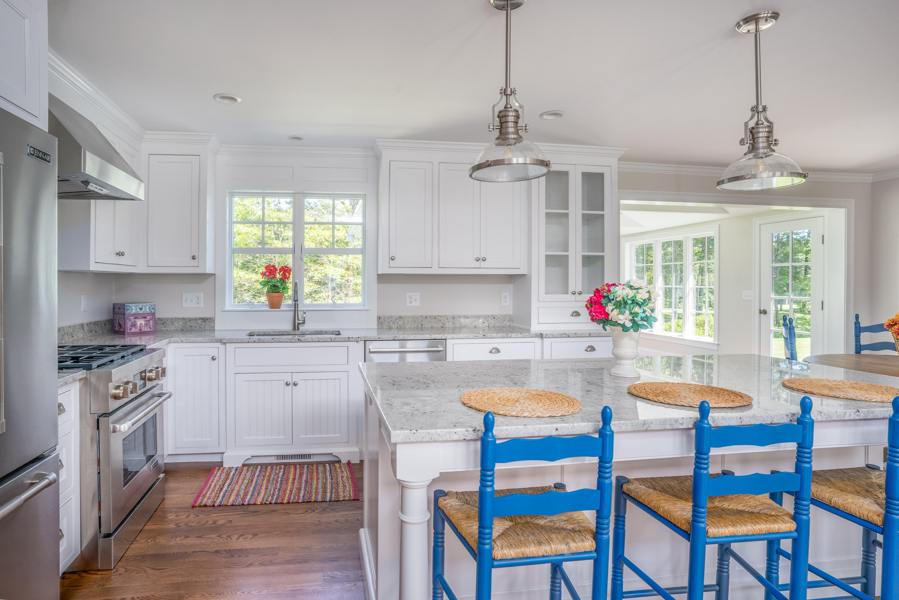 14 Crocker Rise Road Harwich, MA 02645 - Photo 6 of 38 a kitchen with a dining table chairs stainless steel appliances and cabinets