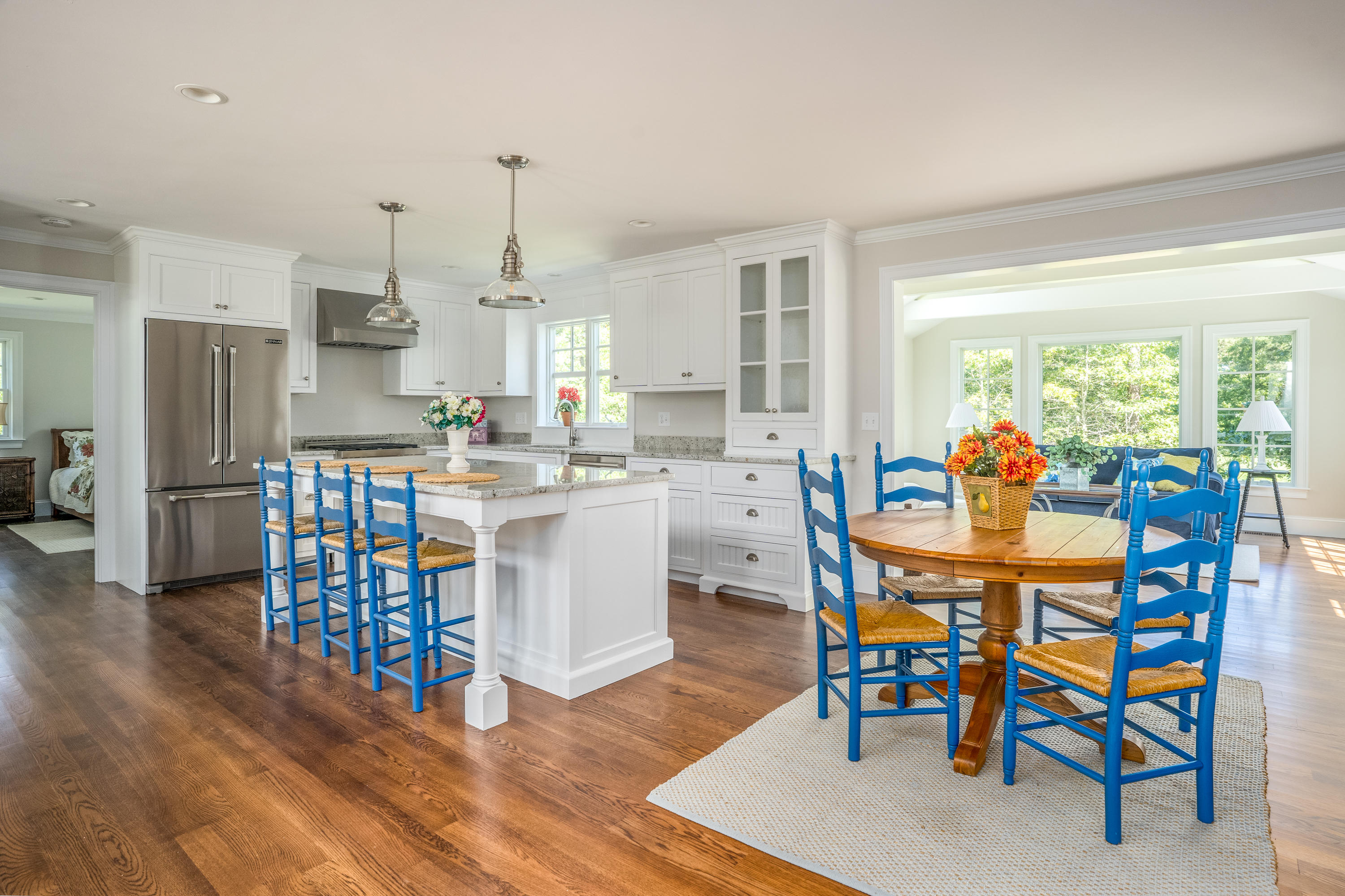 14 Crocker Rise Road Harwich, MA 02645 - Photo 9 of 38 a dining room with furniture a chandelier and wooden floor