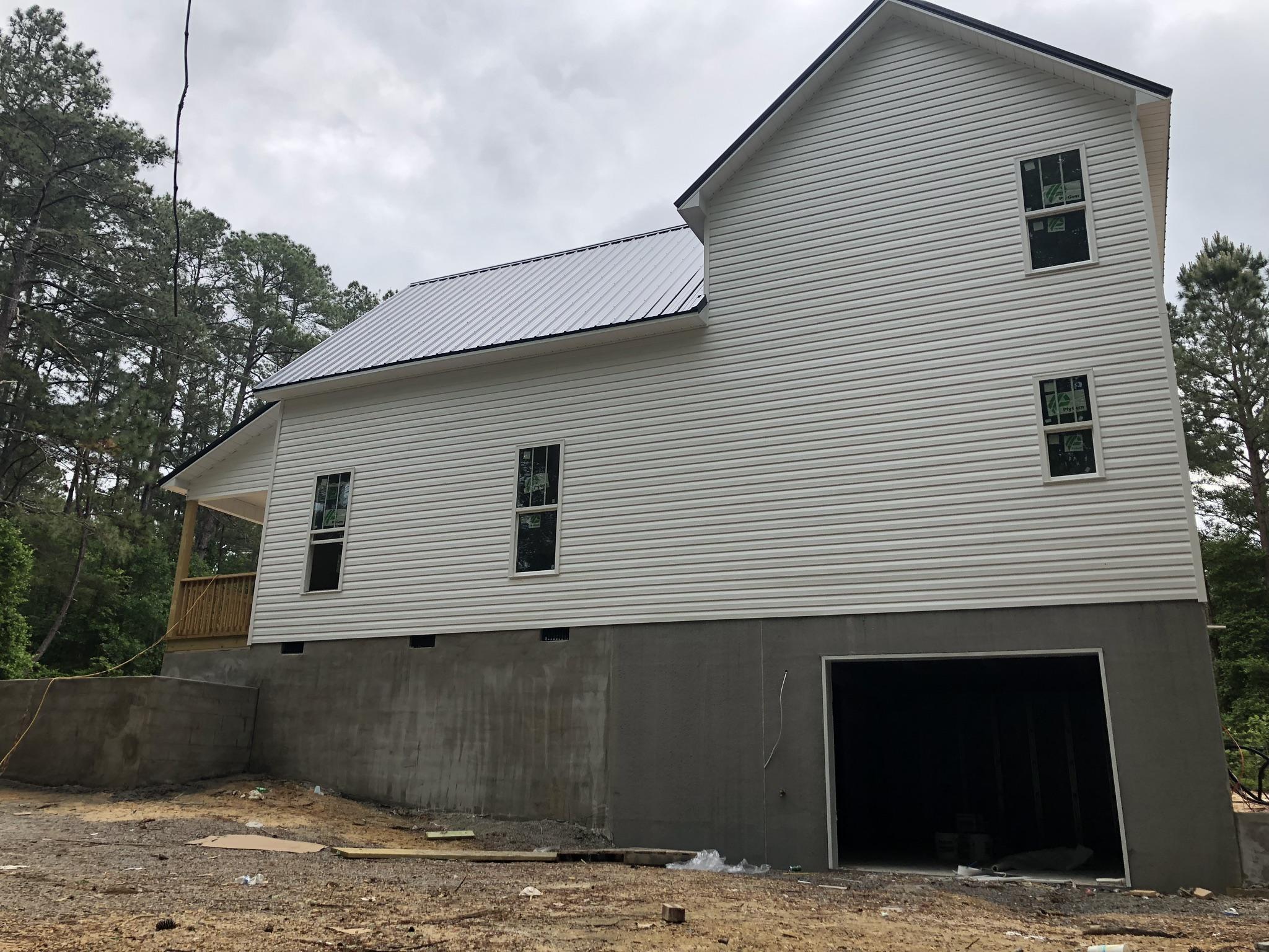 155 Hardee Branch Road West End, NC 27376 - Photo 19 of 25 basement garage is tucked away out of site for extra privacy and security