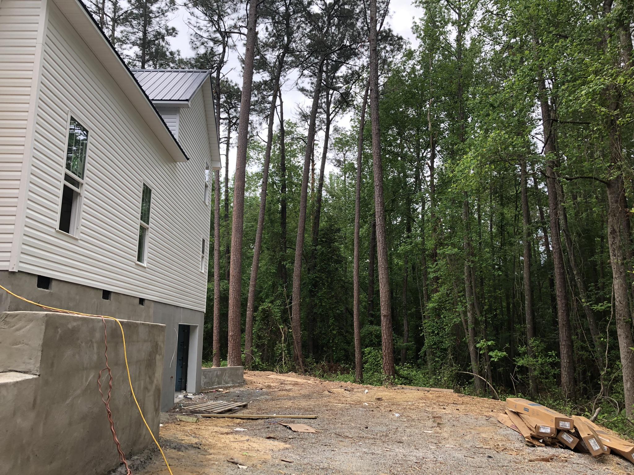 155 Hardee Branch Road West End, NC 27376 - Photo 22 of 25 on the right side of the home is a small natural brook. It could be cleaned and become a great landscaping feauture