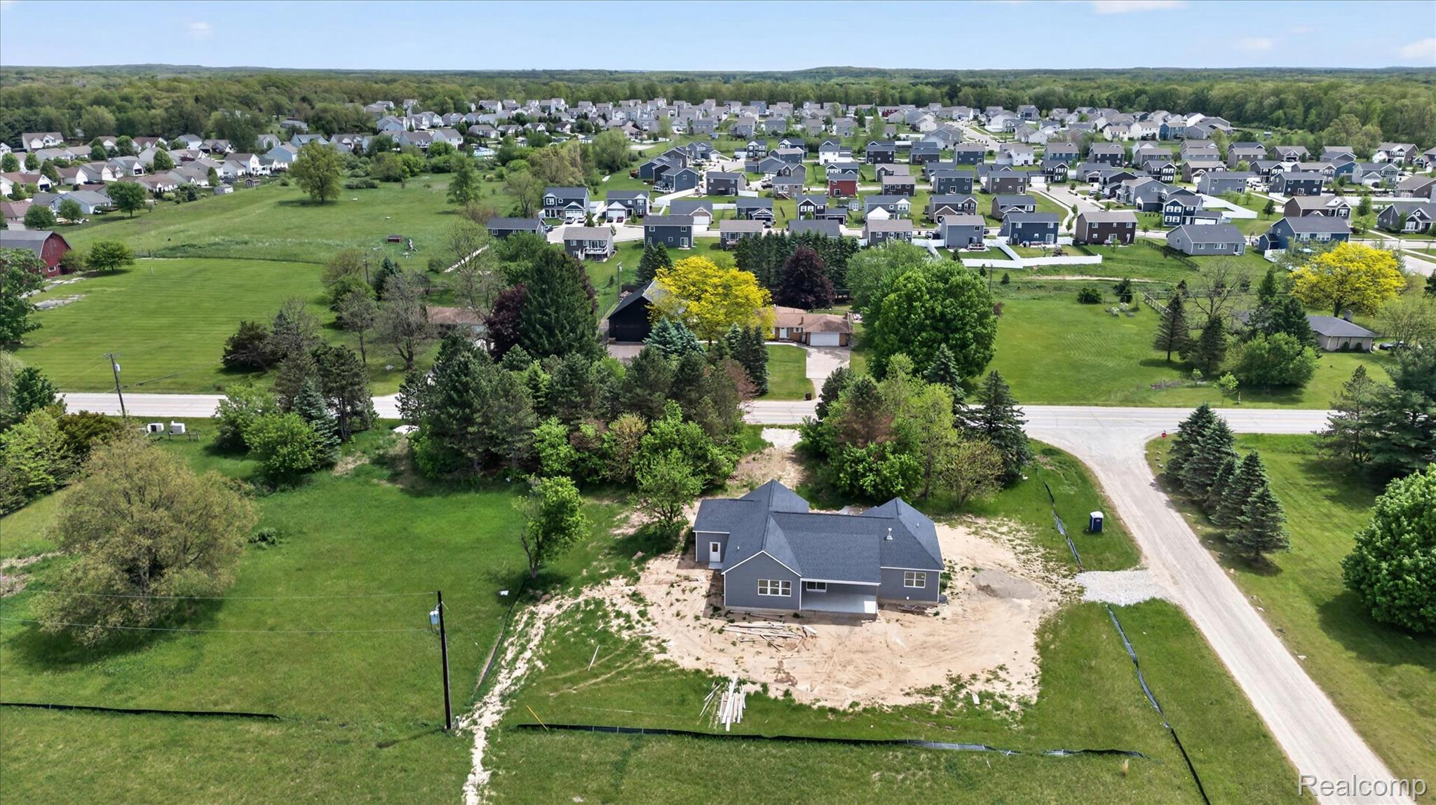 3297 Oak Grove Road Howell, MI 48855 - Photo 34 of 40 Aerial view showcasing the balance of privacy and proximity to everyday conveniences.
