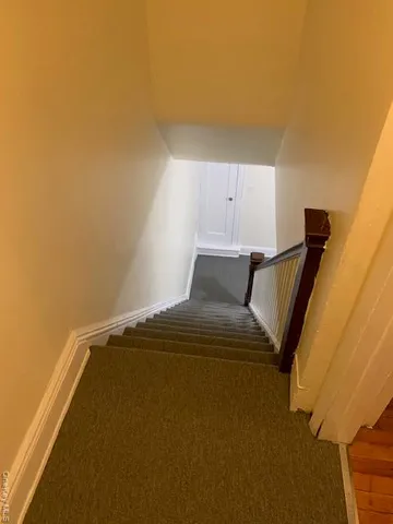a view of hallway with wooden floor