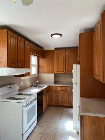 a bathroom with a sink toilet vanity and tub