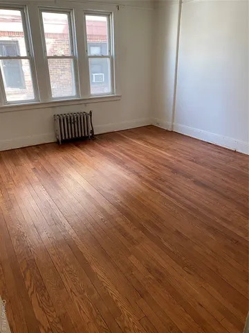 a spacious bathroom with a double vanity sink and mirror