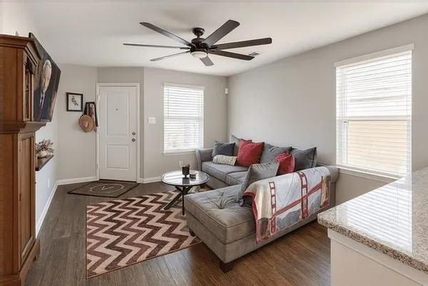 a living room with furniture and a window