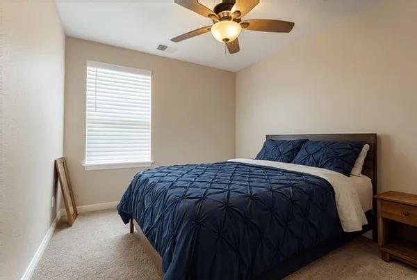 a bedroom with a bed and window