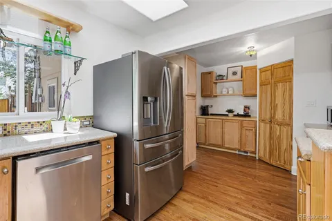 a kitchen with stainless steel appliances a refrigerator and a stove