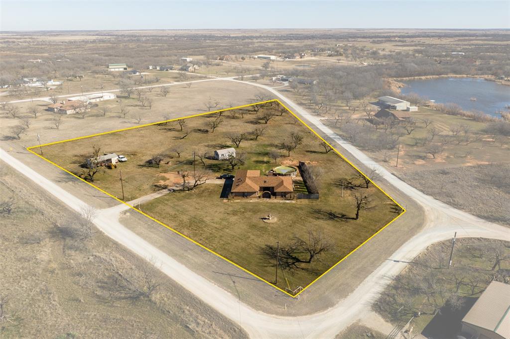 144 Crest Trail Wichita Falls, TX 76310 - Photo 1 of 1 Drone / aerial view featuring a water view and a rural view