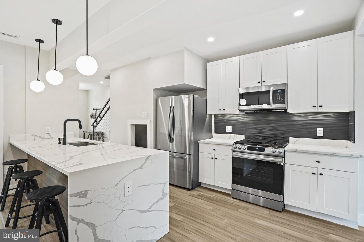 719 Quebec Place Northwest Washington, DC 20010 - Photo 8 of 32 Sleek modern kitchen with elegant finishes.