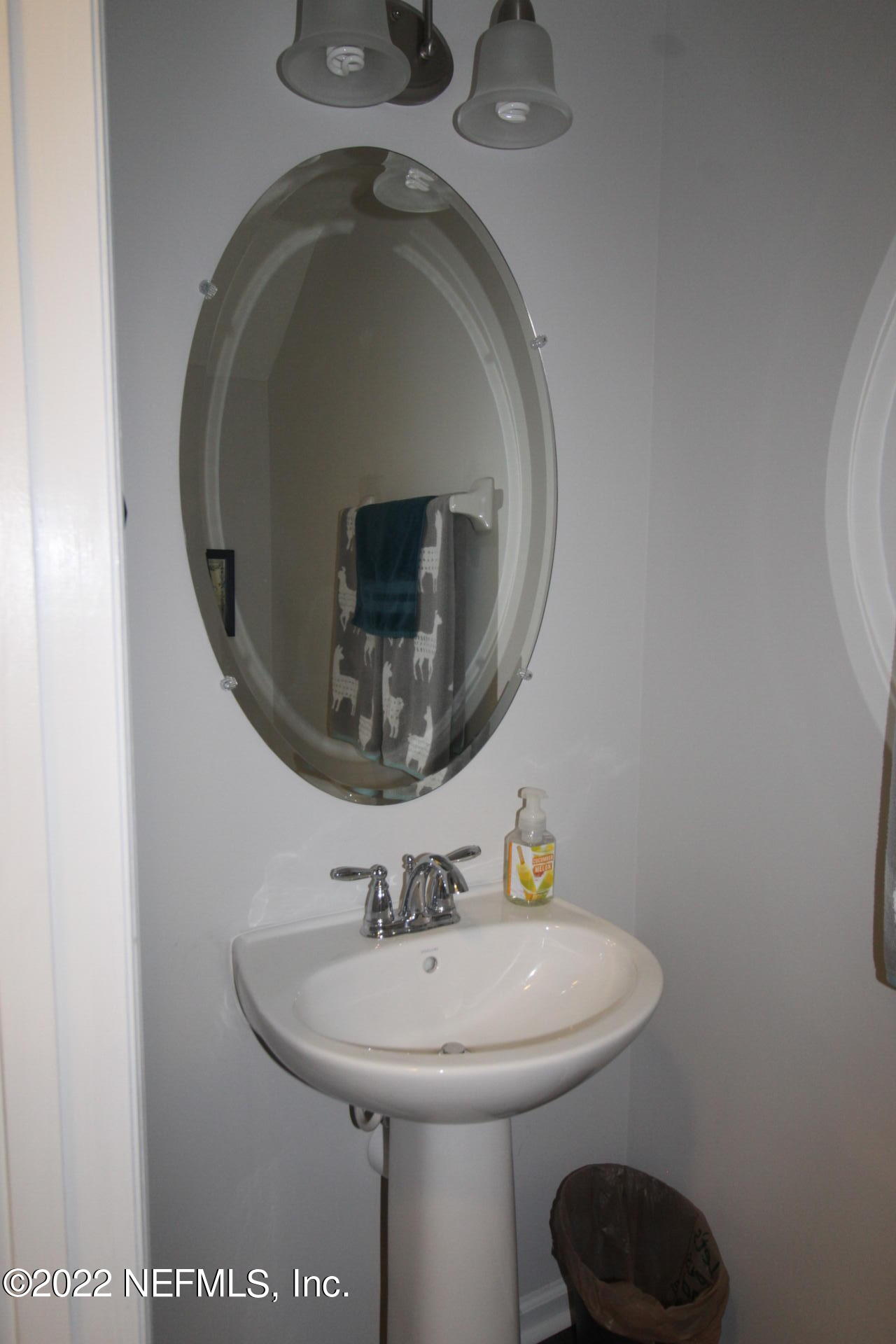 552 Richmond Drive St. Johns, FL 32259 - Photo 20 of 50 a bathroom with a sink and a mirror